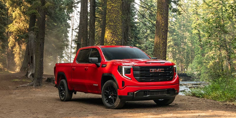 2026 GMC Sierra 1500 pickup truck front exterior view with bold grille and LED lighting.